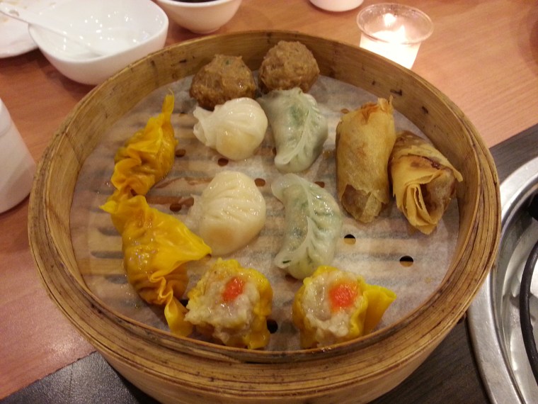 Assorted Dim Sum Platter at David's Tea House in bamboo steamer with hakaw siomai spring rolls dumplings